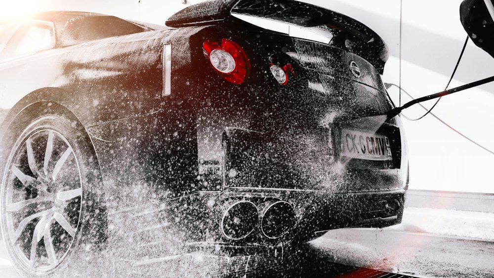 Car being pressure washed